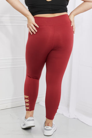 Shop Yelete Ready For Action Full Size Ankle Cutout Active Leggings in Brick Red - High-Quality U.S. Made Women’s Fashion with Free & Fast Shipping