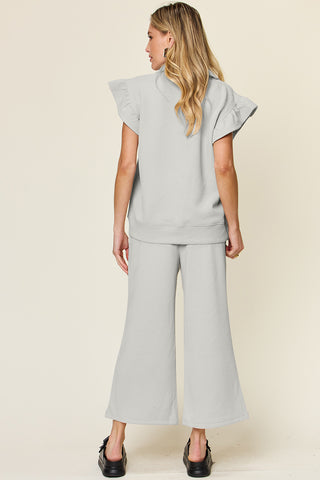 Shop Double Take Texture Ruffle Short Sleeve Top and Drawstring Wide Leg Pants Set - High-Quality U.S. Made Women’s Fashion with Free Fast Shipping