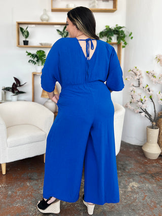 Shop Double Take Full Size Surplice Wide Leg Jumpsuit with Pockets - High-Quality U.S. Made Women’s Fashion with Free & Fast Shipping