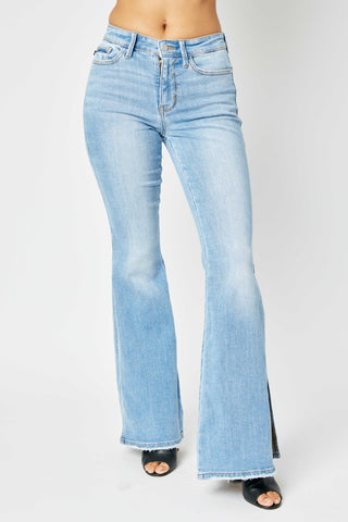 Shop Medium Judy Blue Full Size Mid Rise Raw Hem Slit Flare Jeans - High-Quality U.S. Made Women’s Fashion with Free & Fast Shipping