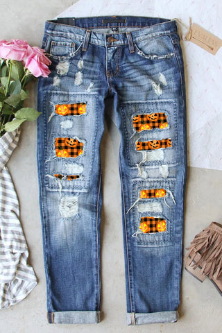 Shop Medium Distressed Pumpkin Pattern Jeans with Pockets - High-Quality U.S. Made Women’s Fashion with Free & Fast Shipping