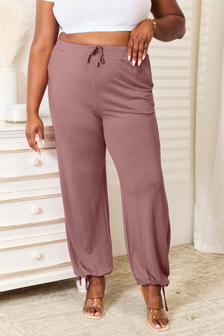 Shop Dusty Pink Basic Bae Full Size Soft Rayon Drawstring Waist Pants with Pockets - High-Quality U.S. Made Women’s Fashion with Free & Fast Shipping