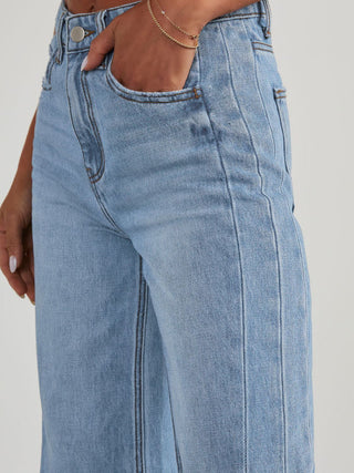 Shop Raw Hem Wide Leg Jeans with Pockets - High-Quality U.S. Made Women’s Fashion with Free & Fast Shipping