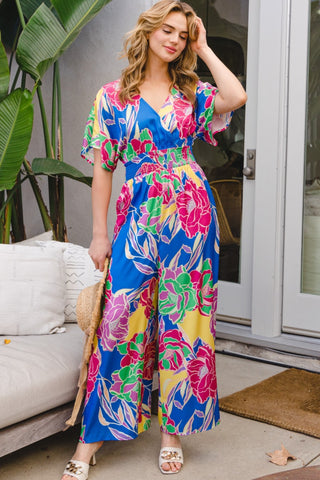 Shop ODDI Full Size Floral Smocked Tied Back Jumpsuit - High-Quality U.S. Made Women’s Fashion with Free & Fast Shipping