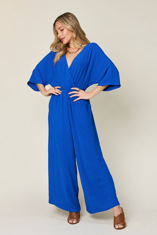 Shop Royal Blue Double Take Full Size Surplice Wide Leg Jumpsuit with Pockets - High-Quality U.S. Made Women’s Fashion with Free & Fast Shipping