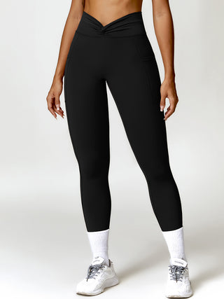 Shop Black Twisted High Waist Active Pants with Pockets - High-Quality U.S. Made Women’s Fashion with Free & Fast Shipping