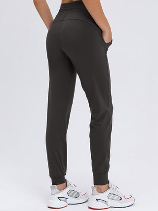 Shop Double Take Tied Joggers with Pockets - High-Quality U.S. Made Women’s Fashion with Free & Fast Shipping