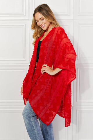 Shop Justin Taylor Pom-Pom Asymmetrical Poncho Cardigan in Red - High-Quality U.S. Made Women’s Fashion with Free & Fast Shipping