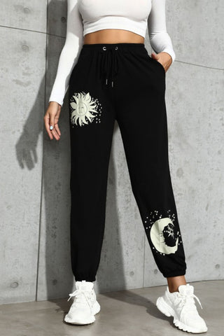 Shop Black Sun and Moon Graphic Drawstring Joggers - High-Quality U.S. Made Women’s Fashion with Free & Fast Shipping