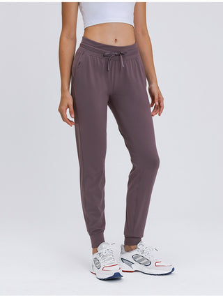 Shop Dusty Pink Double Take Tied Joggers with Pockets - High-Quality U.S. Made Women’s Fashion with Free & Fast Shipping