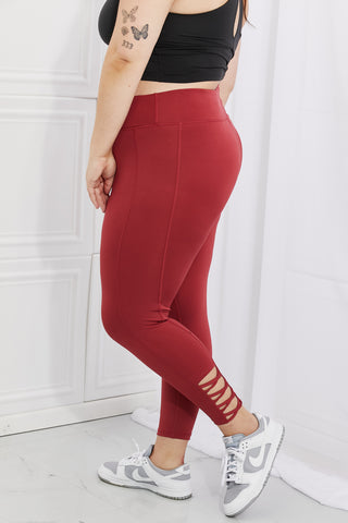 Shop Yelete Ready For Action Full Size Ankle Cutout Active Leggings in Brick Red - High-Quality U.S. Made Women’s Fashion with Free & Fast Shipping