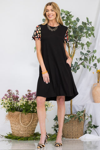 Shop Black Celeste Full Size Leopard Short Sleeve Dress with Pockets - High-Quality U.S. Made Women’s Fashion with Free & Fast Shipping