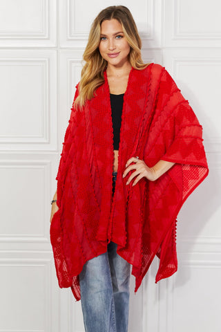 Shop Justin Taylor Pom-Pom Asymmetrical Poncho Cardigan in Red - High-Quality U.S. Made Women’s Fashion with Free & Fast Shipping