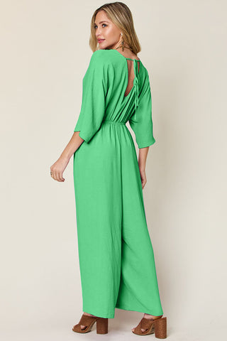 Shop Double Take Full Size Surplice Wide Leg Jumpsuit with Pockets - High-Quality U.S. Made Women’s Fashion with Free & Fast Shipping