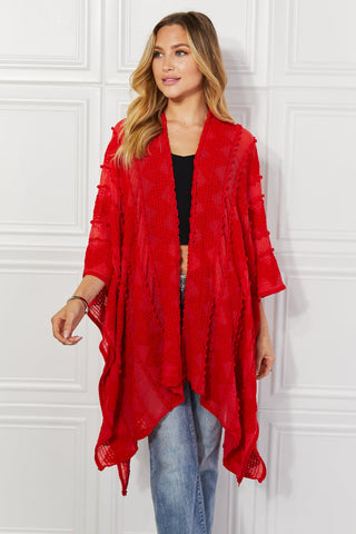 Shop Justin Taylor Pom-Pom Asymmetrical Poncho Cardigan in Red - High-Quality U.S. Made Women’s Fashion with Free & Fast Shipping