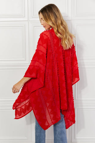 Shop Justin Taylor Pom-Pom Asymmetrical Poncho Cardigan in Red - High-Quality U.S. Made Women’s Fashion with Free & Fast Shipping